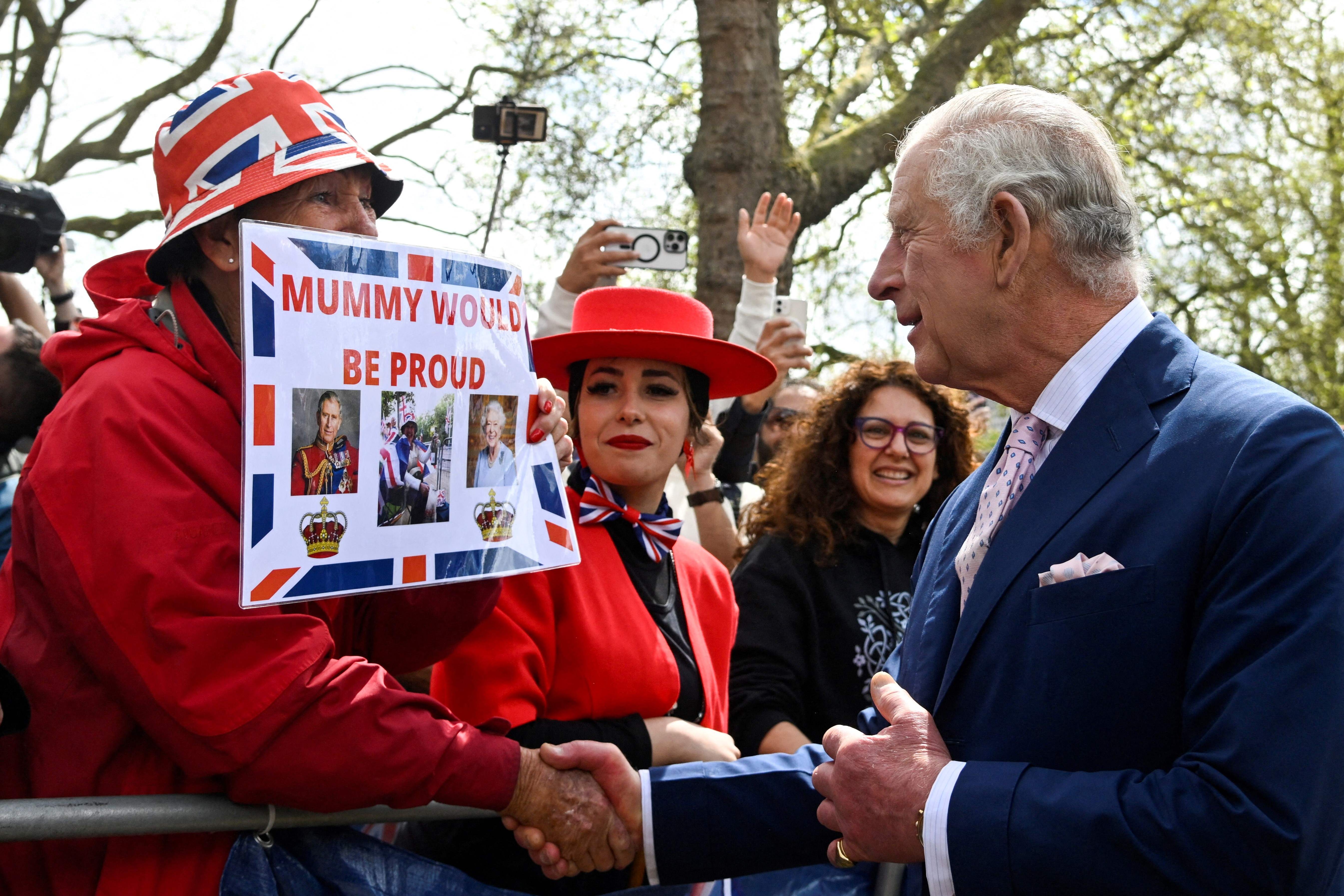 Britain's King Charles III meets members of the public gather on The Mall, near Buckingham Palace in central London