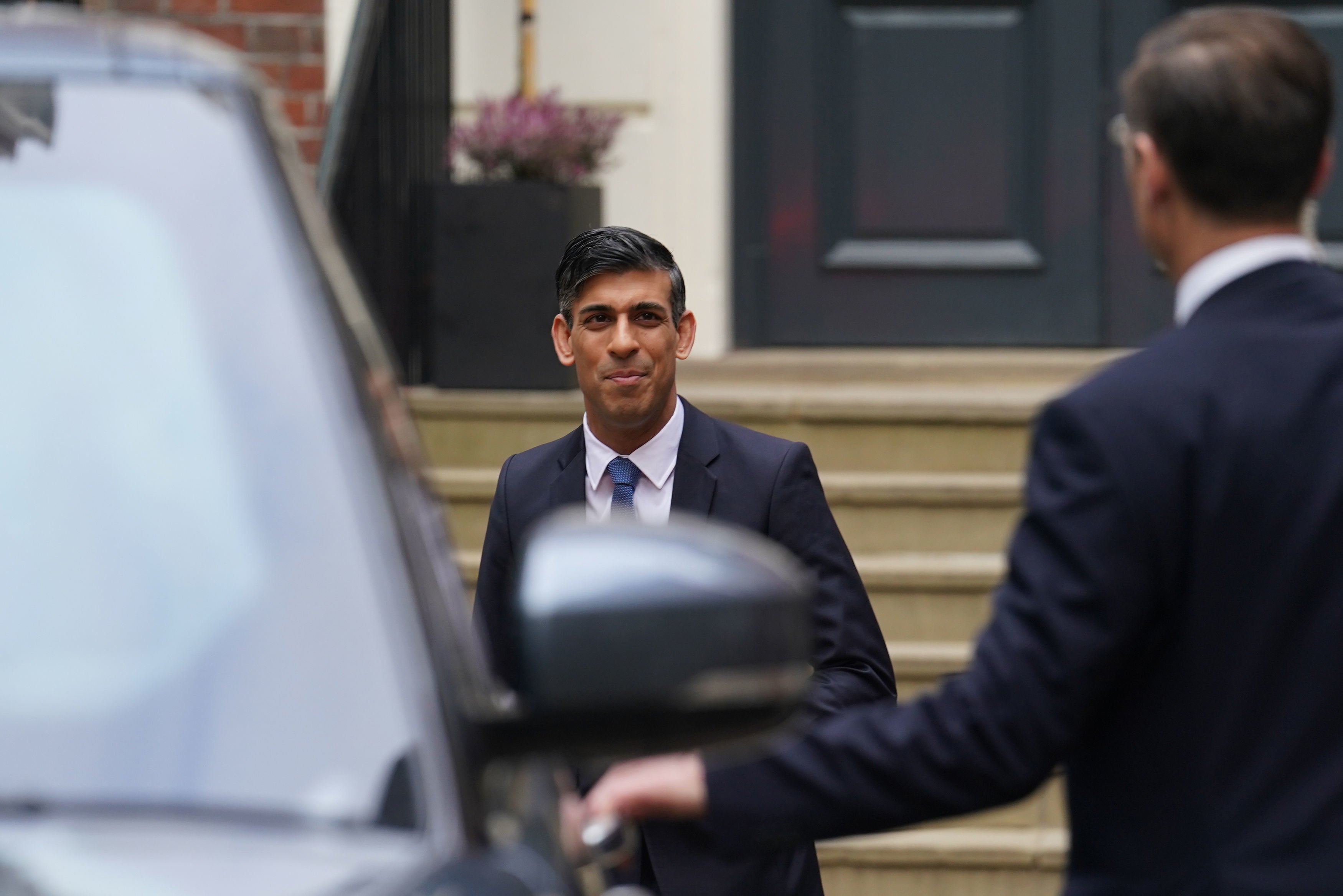 Prime Minister Rishi Sunak leaves the Conservative Party headquarters in central London, after the party suffered council losses in the local elections