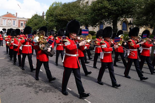The band of the Welsh Guards march down the High Street towards Victoria barracks in Windsor after a changing of the guards ceremony at Windsor Castle (Andrew Matthews/PA)