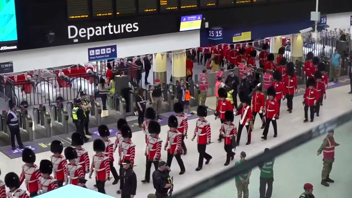 Soldiers arrive by train at London Waterloo for King’s coronation