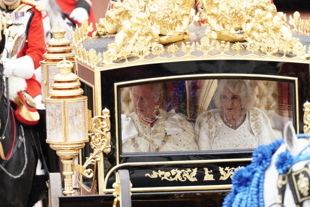 <p>The King and Queen are carried in the Diamond Jubilee State Coach in the King’s Procession from Buckingham Palace to their coronation ceremony at Westminster Abbey (Jordan Pettitt/PA)</p>