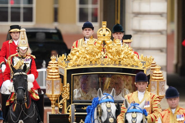 The King and Queen are carried in the Diamond Jubilee State Coach in the King’s Procession from Buckingham Palace to their coronation ceremony at Westminster Abbey (Jordan Pettitt/PA)