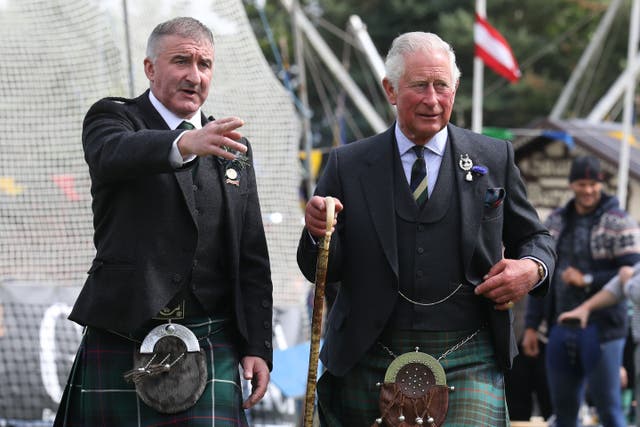Charles with John Sinclair at the Ballater Highland Games (Andrew Milligan/PA)