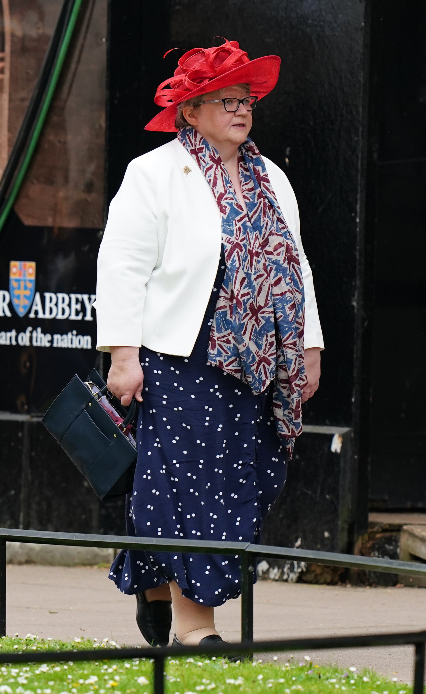 Thérèse Coffey wore a union jack scarf paired with a printed day dress