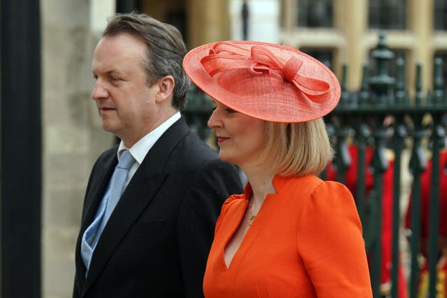 Former prime minister Liz Truss with her husband Hugh O’Leary arriving at Westminster Abbey (Andrew Milligan/PA)