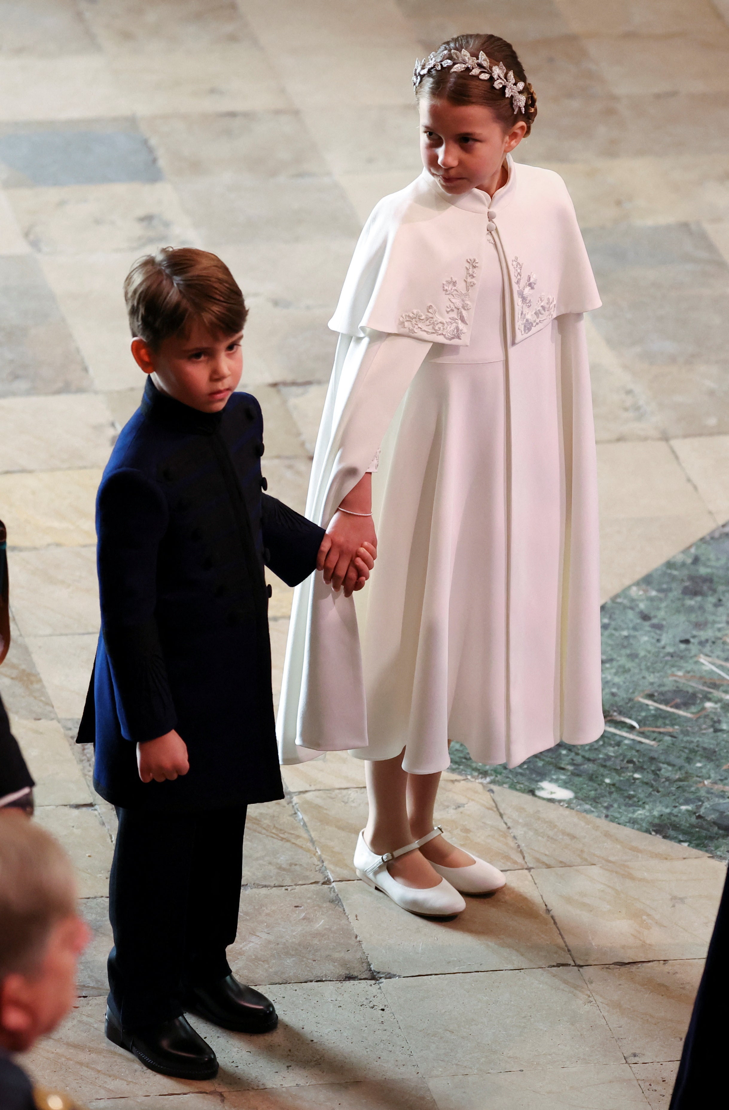 Princess Charlotte’s ivory outfit was made by Alexander McQueen