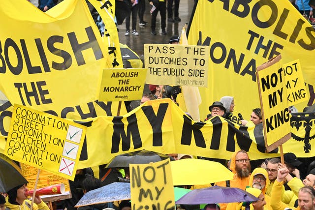 <p>Protesters wave “Not My King” signs near Trafalgar Square ahead of the coronation of King Charles III</p>