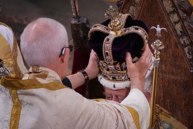 The King is crowned with St Edward’s Crown by the Archbishop of Canterbury (Aaron Chown/PA)