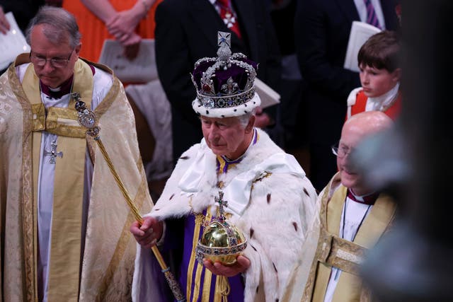 The King departs following his coronation at Westminster Abbey (Phil Noble/PA)