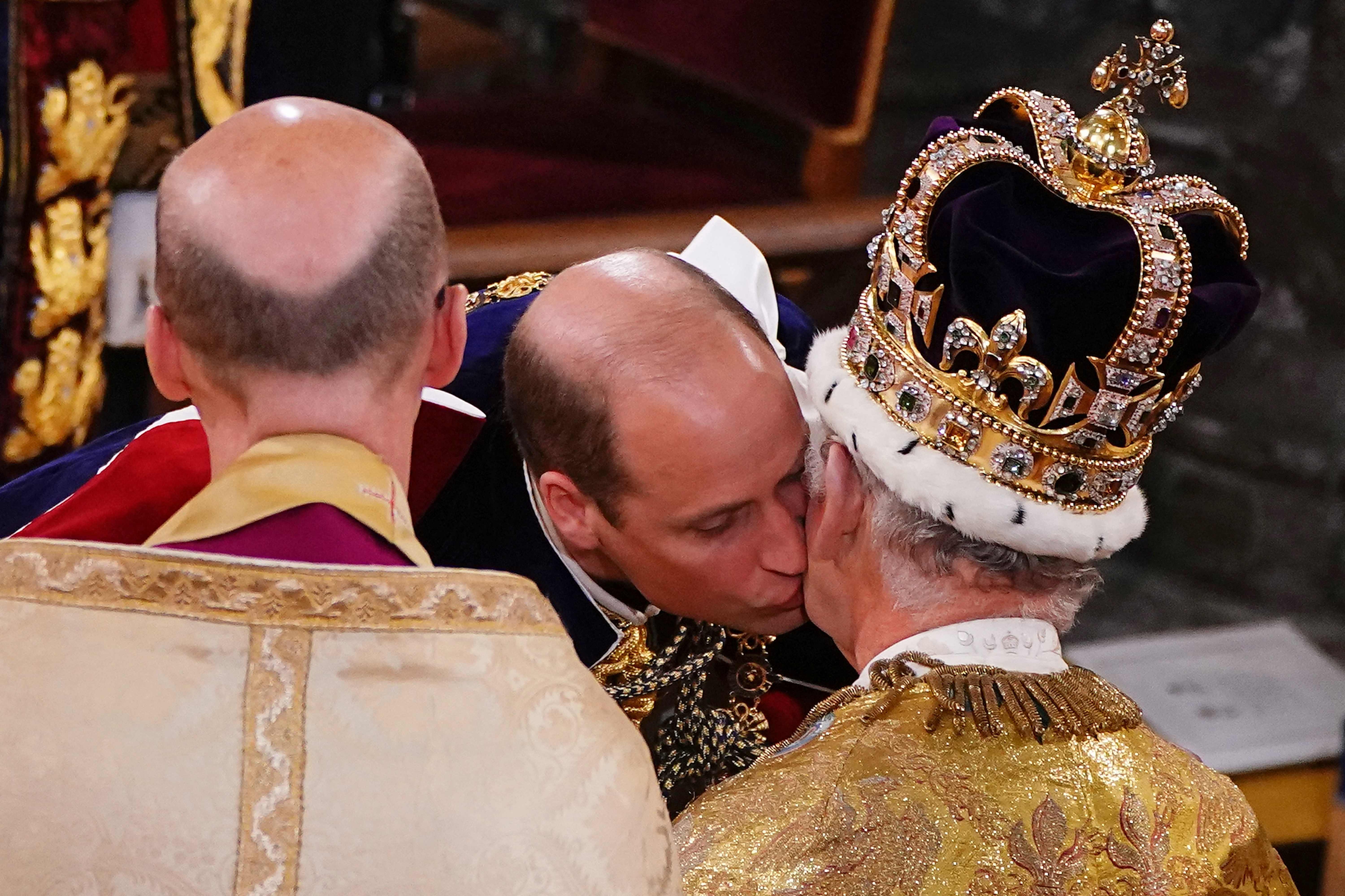 Charles looked emotional as his son, William, kissed him on the cheek