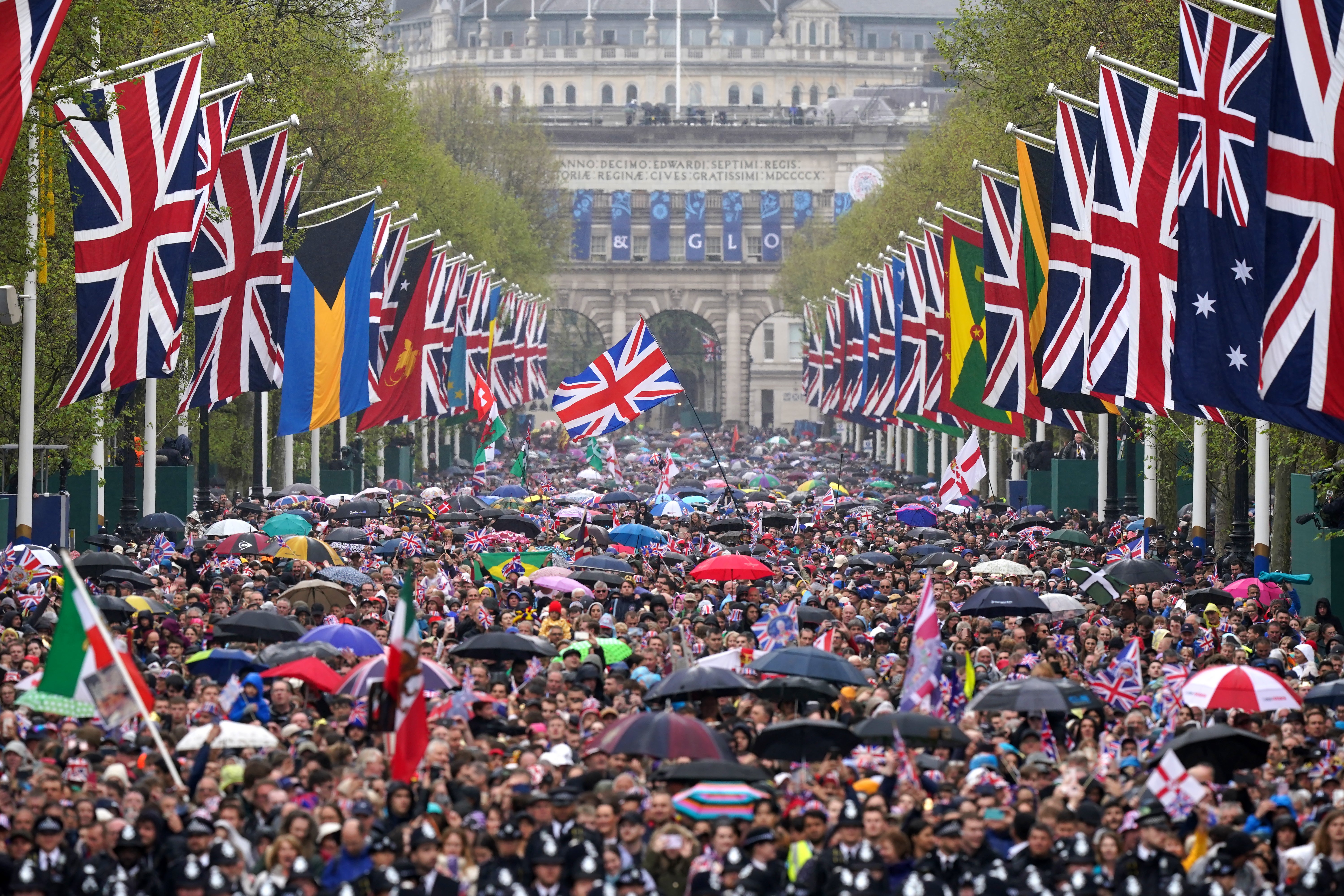 Crowds brave the wet weather on the Mall in central London
