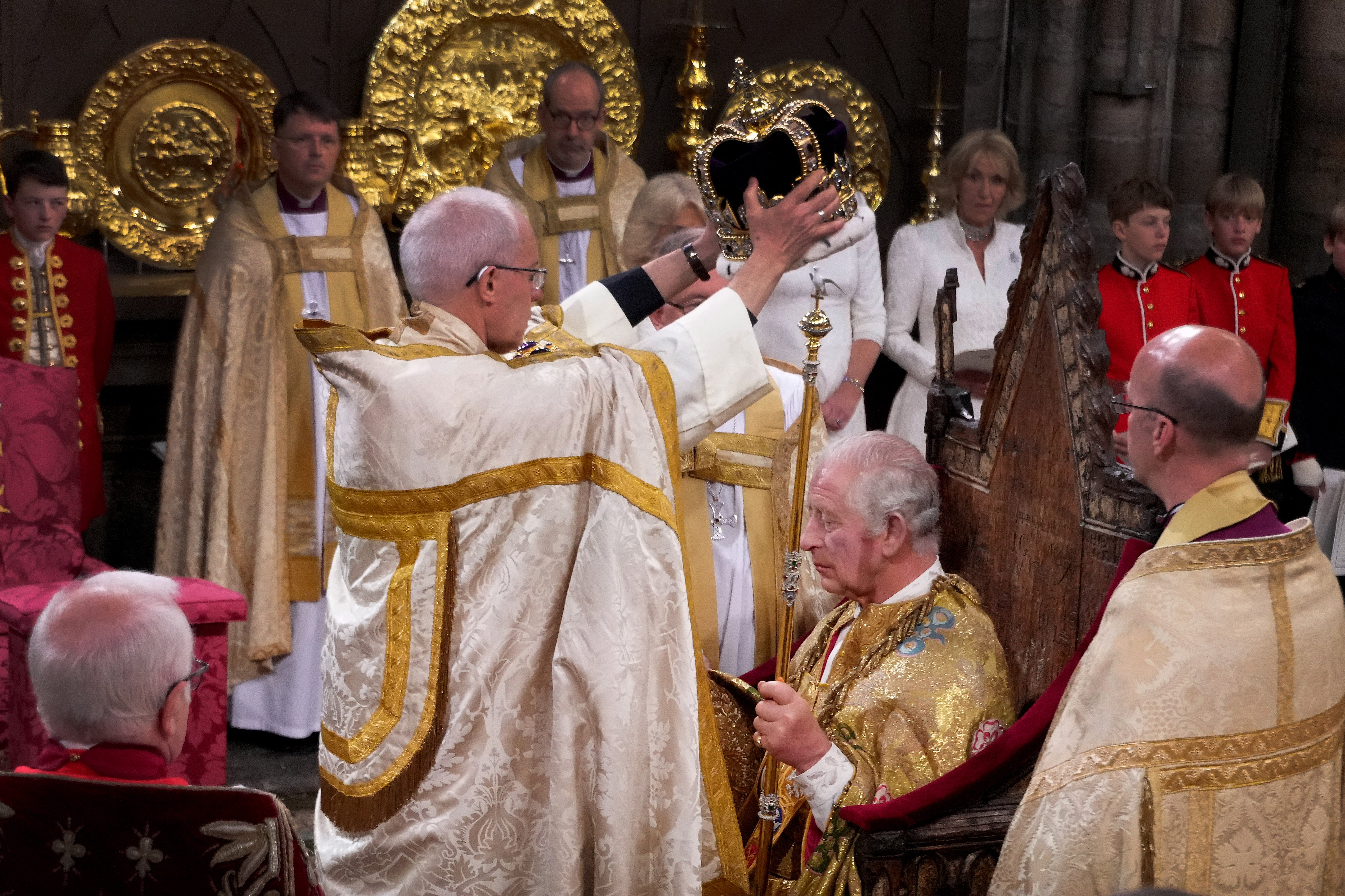 King Charles being crowned by the Archbishop of Canterbury, Justin Welby, during his coronation ceremony
