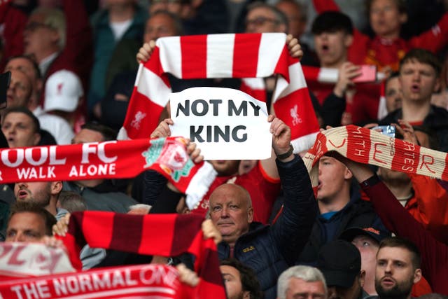 <p>Liverpool fans hold up a sign before the Premier League match at Anfield (Mike Egerton/PA Wire)</p>