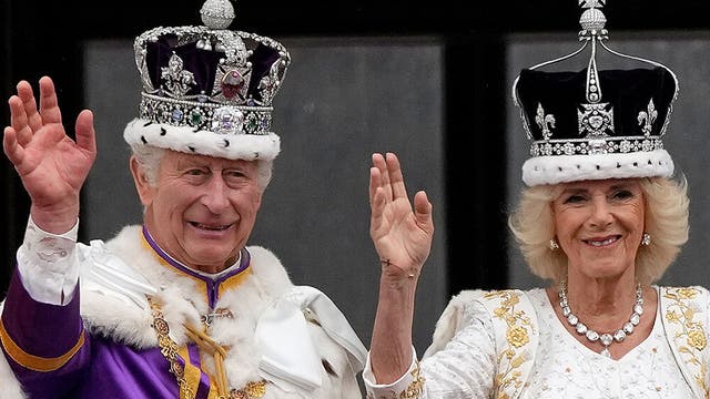 Charles and Camilla waving