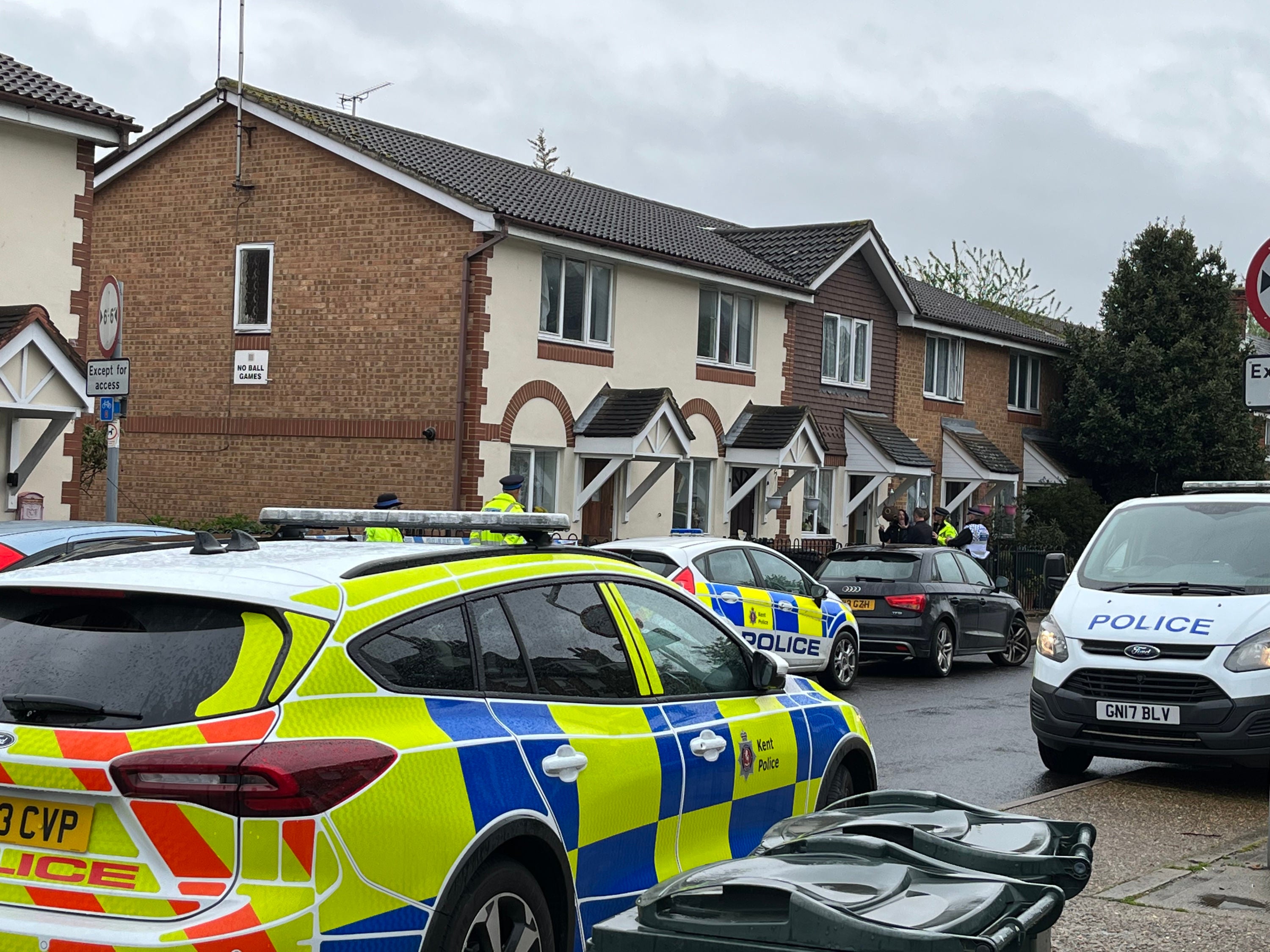Police officers at the scene in Priory Road, Dartford, Kent, a woman has been rushed to hospital with serious injuries after being held hostage at her home, witnesses have said.