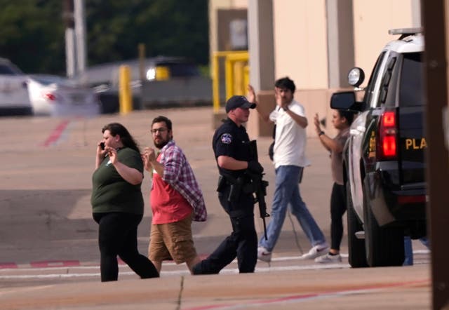 <p>Shoppers evacuate an outlet mall in Allen, Texas, due to a shooting </p>