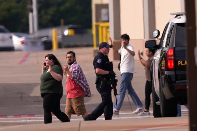 <p>Shoppers evacuate an outlet mall in Allen, Texas, due to a shooting </p>