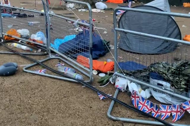 <p>Buckingham Palace Mall littered with tents and union jacks in coronation aftermath</p>