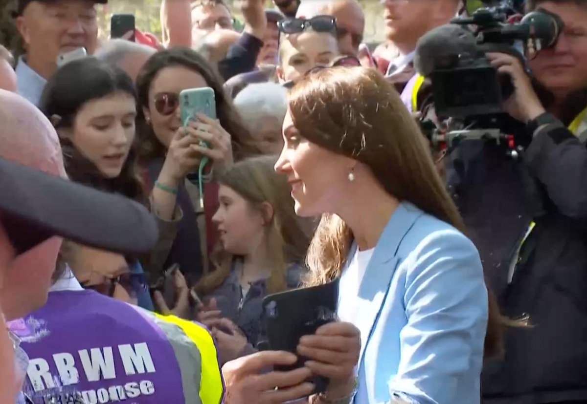 Prince William and Princess Kate joke with children as they greet royal fans at Windsor Castle