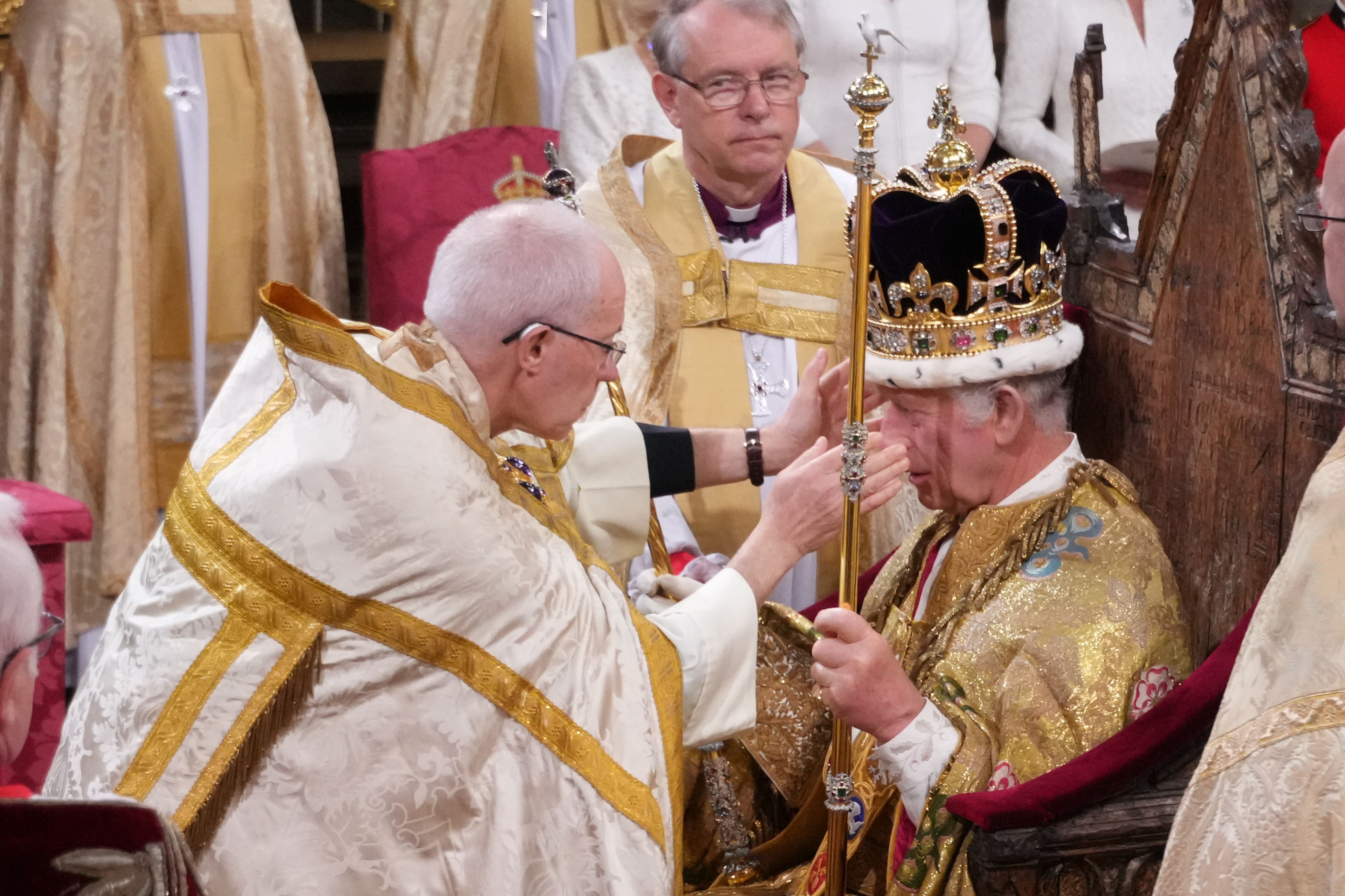 The King is crowned with St Edward’s Crown by The Archbishop of Canterbury (Victoria Jones/PA)