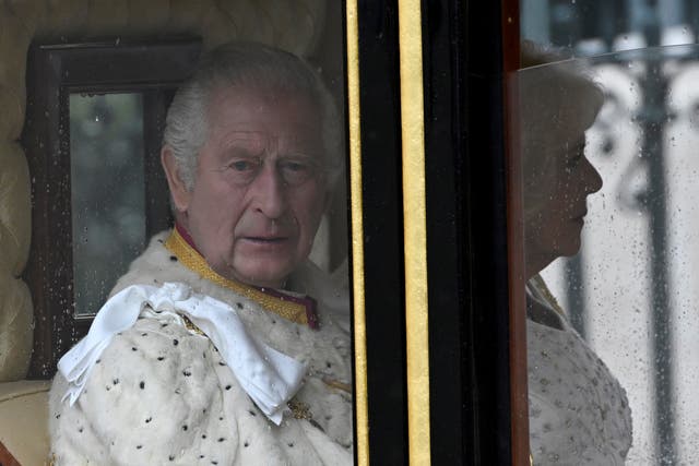 The King and Queen arrive in the Diamond Jubilee State Coach for their coronation (Toby Melville/PA)