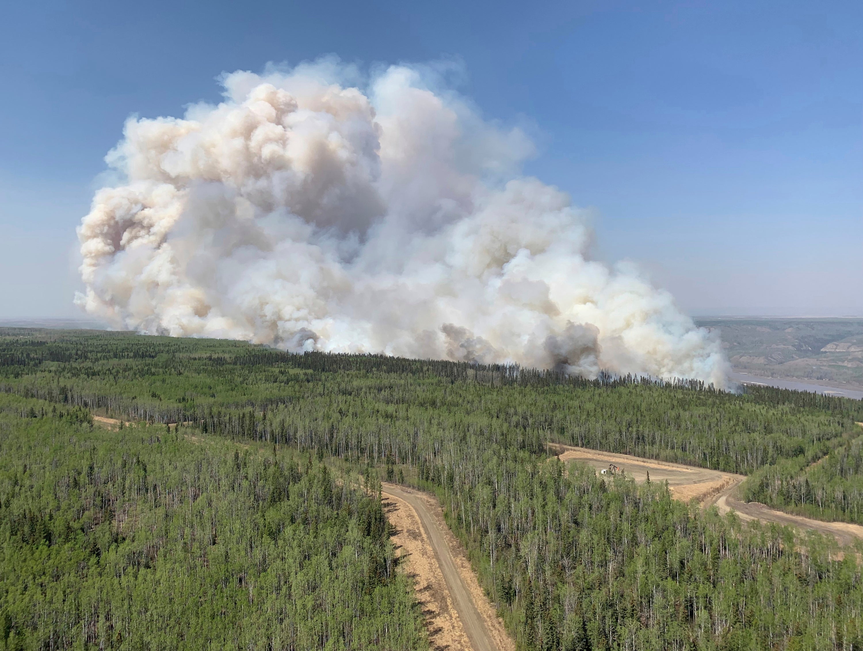 Wildfire burns a section of forest in the Grande Prairie district of Alberta, Canada on May 6