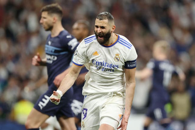 <p>Karim Benzema of Real Madrid celebrates after scoring his side's third goal in the Champions League semi-final win over City at the Bernabeu last season</p>