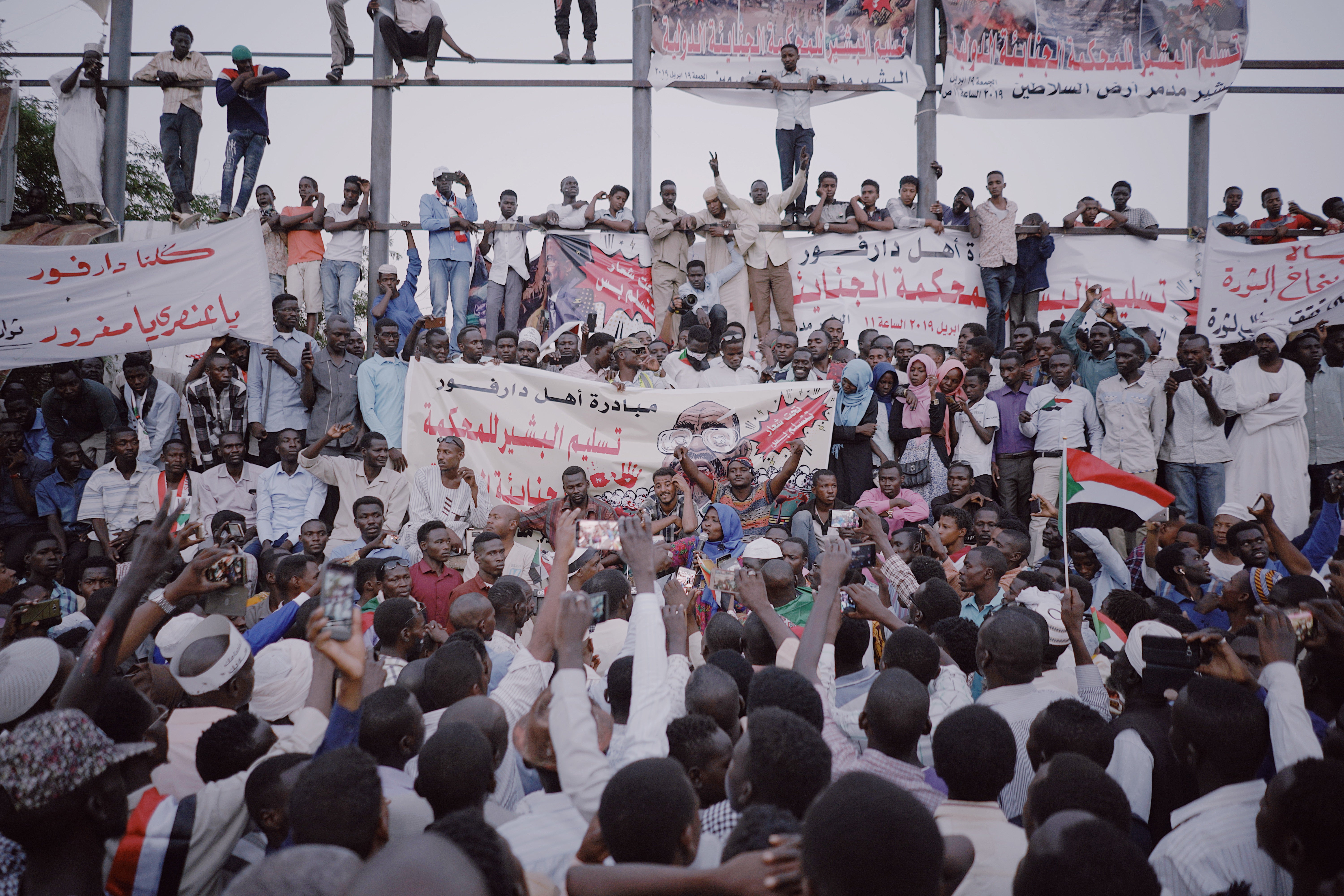 Demonstrators listen to a speech at a protest in Khartoum in 2019 following the overthrow of Omar Hassan al-Bashir