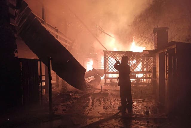 <p>A firefighter at the site of a Russian missiles strike in Odesa, Ukraine early on Monday</p>