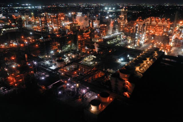 <p>An oil refinery in Torrance, California in March 2022. US oil and gas production costs the US $77bn each year in negative health impacts</p>