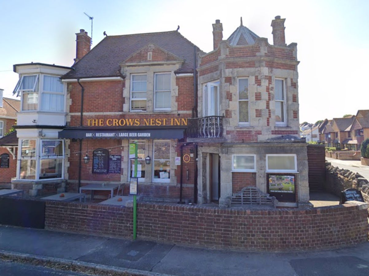 The dog, thought to be a German Wirehaired Pointer, is said to have bitten the young boy at the Crows Nest Inn (pictured) in Swanage, Dorset