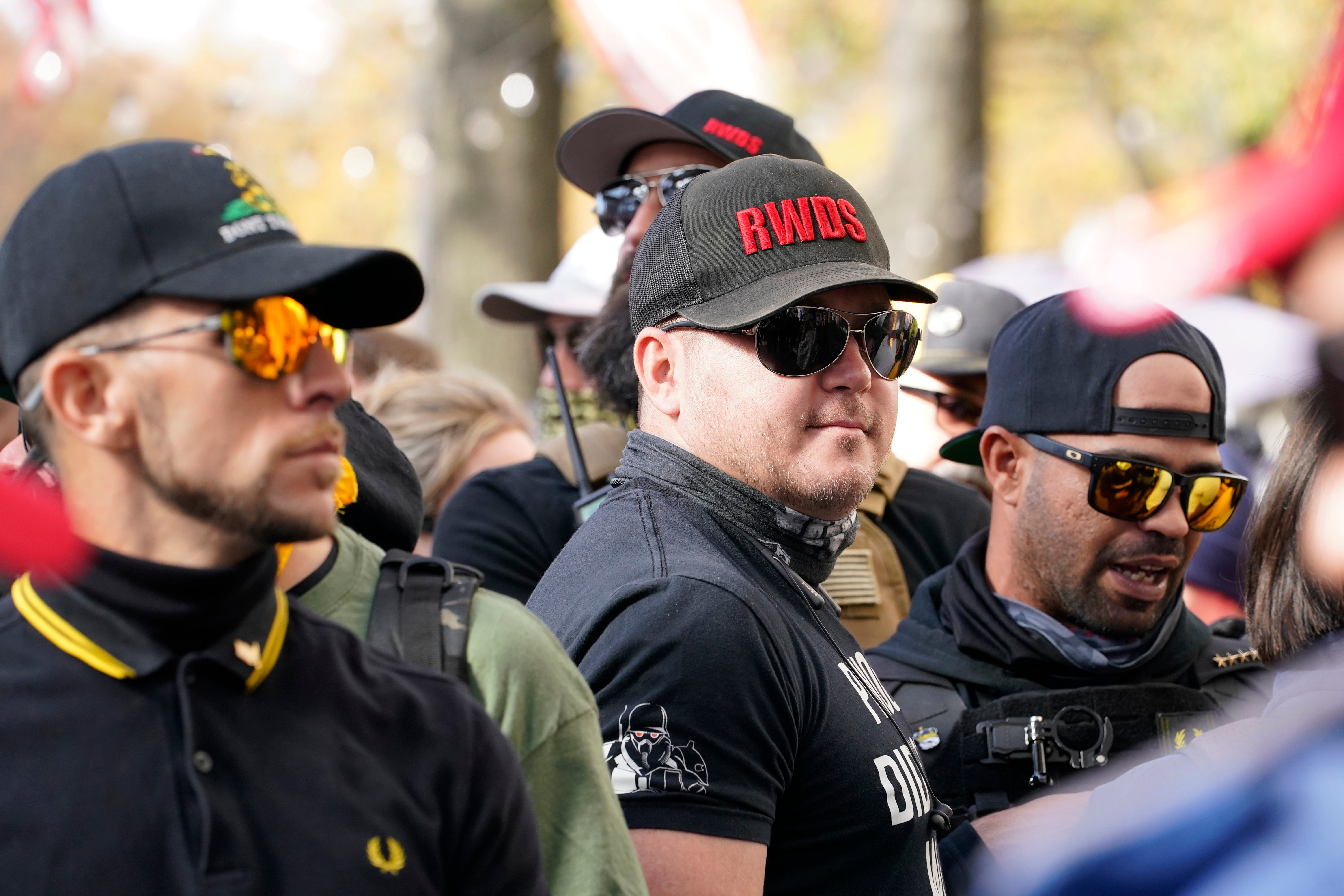 Members of the Proud Boys are photographed with “RWDS” on their hats in 2020.