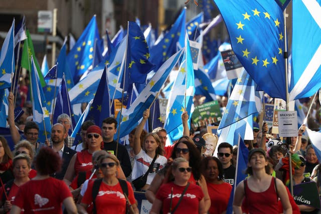 Campaigners at a march calling for the UK to remain in the EU (Andrew Milligan/PA)