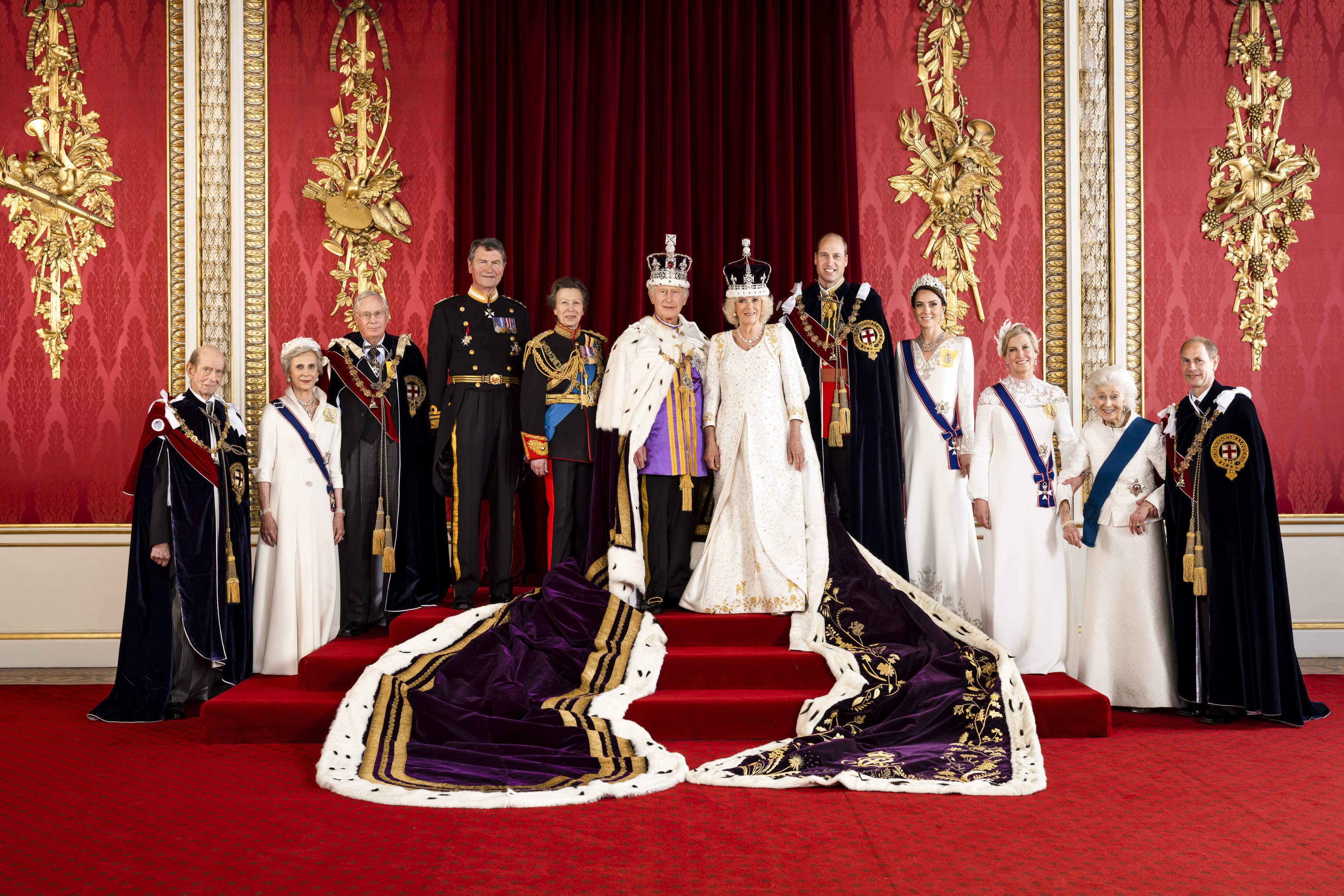 The slimmed-down royal family standing in the throne room at Buckingham Palace (Hugo Burnand/Royal Household 2023/PA)