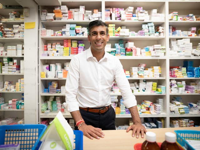 <p>Rishi Sunak during a visit to his family's old business, Bassett Pharmacy, in Southampton</p>