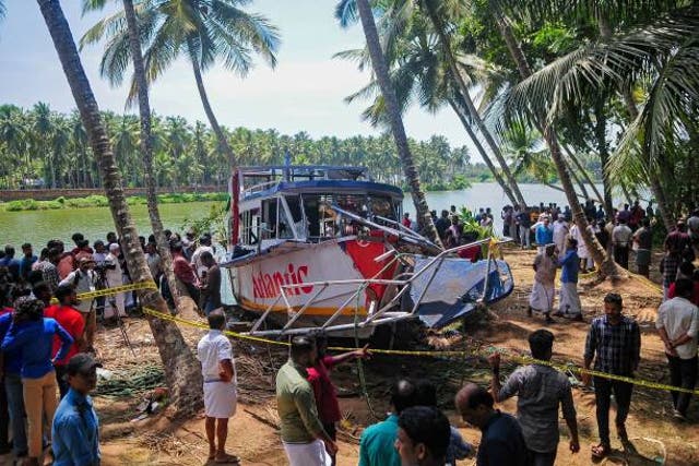 <p>Onlookers gather near the site of a boat accident in Tanur, in Malappuram district on 8 May 2023</p>