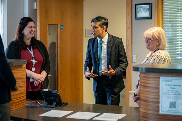 Rishi Sunak meets reception staff during a visit to a GP surgery and pharmacy in Weston, Southampton (Ben Birchall/PA)
