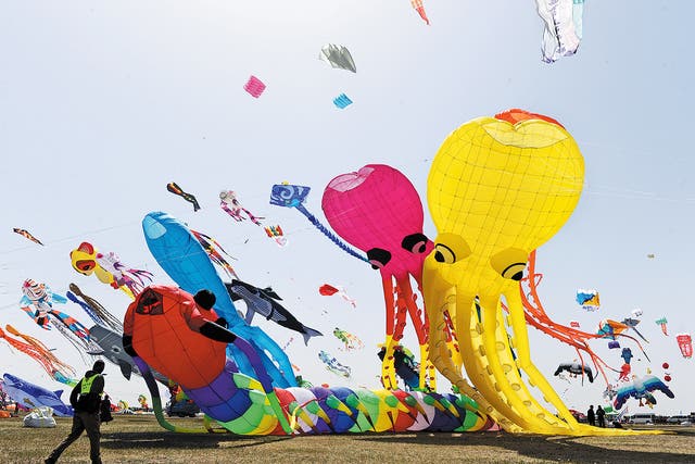 <p>Kites in all shapes and sizes dot the sky on April 16, 2023, during the 40th Weifang International Kite Festival in Weifang, Shandong province </p>