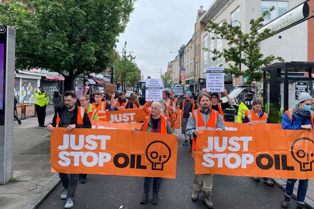 Just Stop Oil protesters take part in a march in Camden Town, north west London, as part of the group’s campaign to convince the Government to end all new oil and gas projects in the UK. Picture date: Tuesday May 9, 2023.