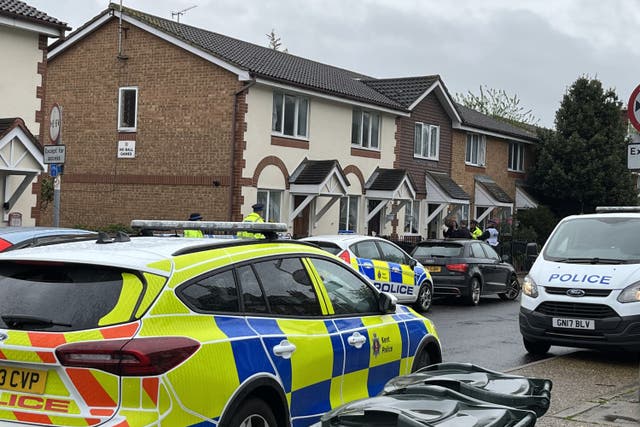 Police officers at the scene in Priory Road, Dartford, Kent, a woman has been rushed to hospital with serious injuries after being held hostage at her home, witnesses have said. Picture date: Saturday May 6, 2023.