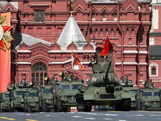 <p>A Soviet-era T-34 tank leads a column of Russian armoured vehicles in Red Square during the Victory Day military parade </p>