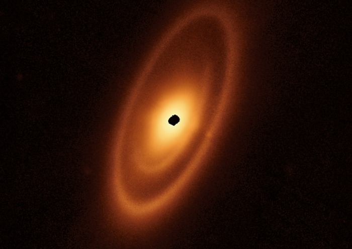 This image of the dusty debris disk surrounding the young star Fomalhaut is from Webb’s Mid-Infrared Instrument (MIRI). It reveals three nested belts extending out to 14 billion miles (23 billion kilometers) from the star. The inner belts – which had never been seen before – were revealed by Webb for the first time