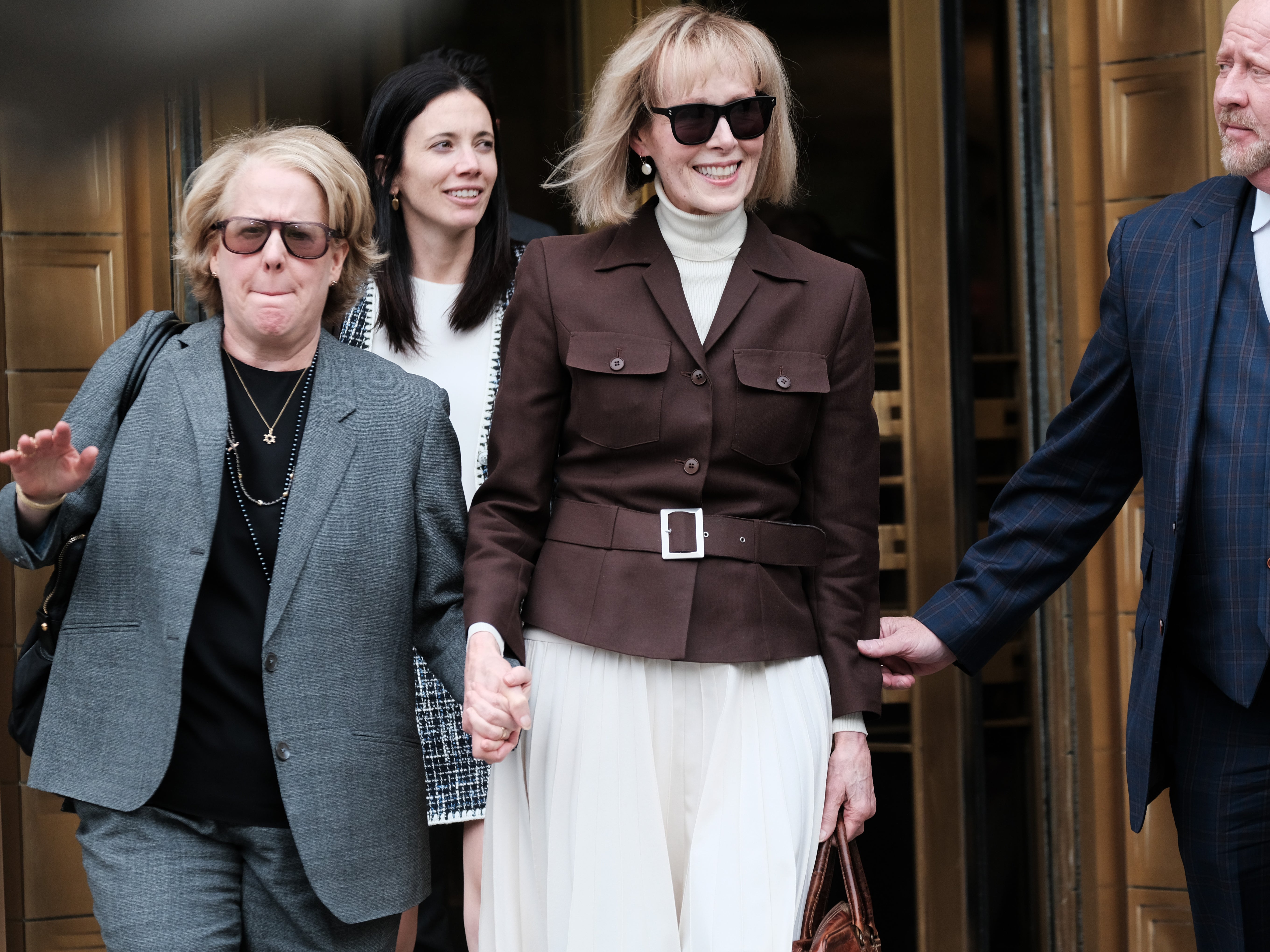 E Jean Carroll (center) leaves a Manhattan courthouse after a jury found Donald Trump liable for sexually abusing her in a Manhattan department store in the 1990s on 9 May 2023 in New York City