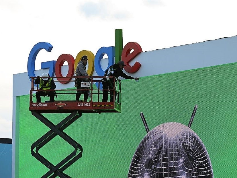 Workers set up a Google display ahead of CES 2023 on 3 January, 2023 at the Las Vegas Convention Center in Las Vegas, Nevada