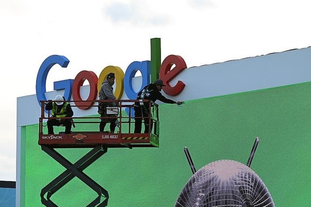 <p>Workers set up a Google display ahead of CES 2023 on 3 January, 2023 at the Las Vegas Convention Center in Las Vegas, Nevada</p>