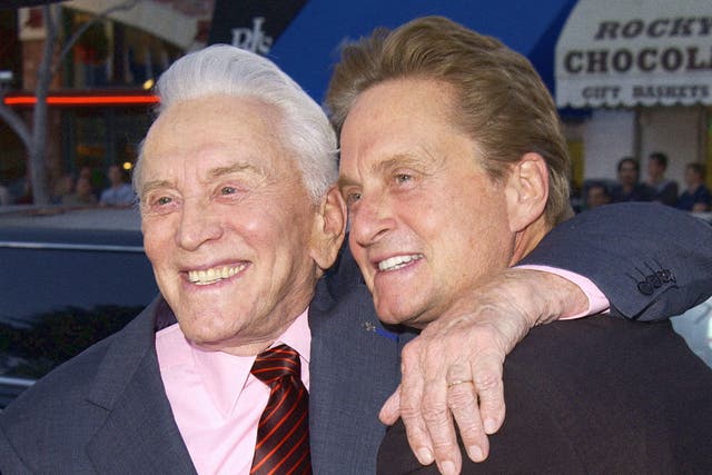<p>Kirk Douglas with his son Michael at a film premiere in 2003</p>