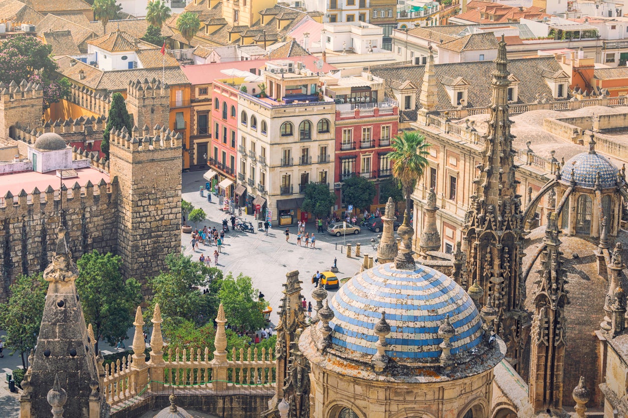 A view of Seville with the spires of the Cathedral in the foreground