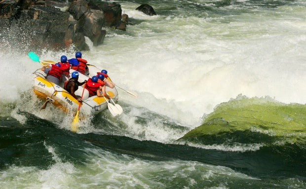 White water rafters face the rapids of the Zambezi River