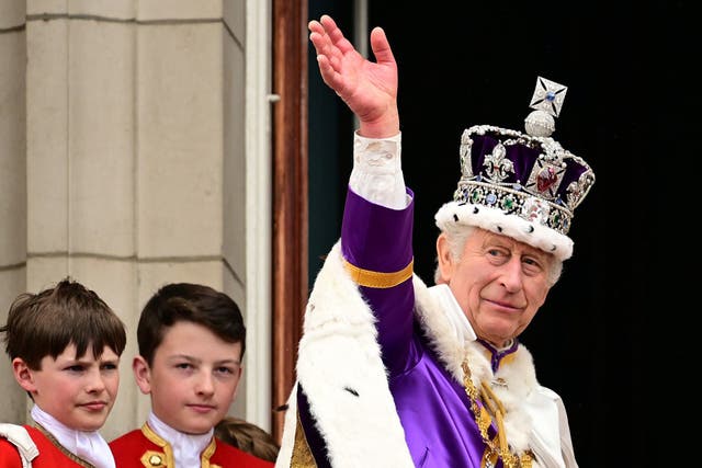 <p>King Charles waves at crowds from the balcony of Buckingham Palace after his coronation on 6 May 2023 </p>
