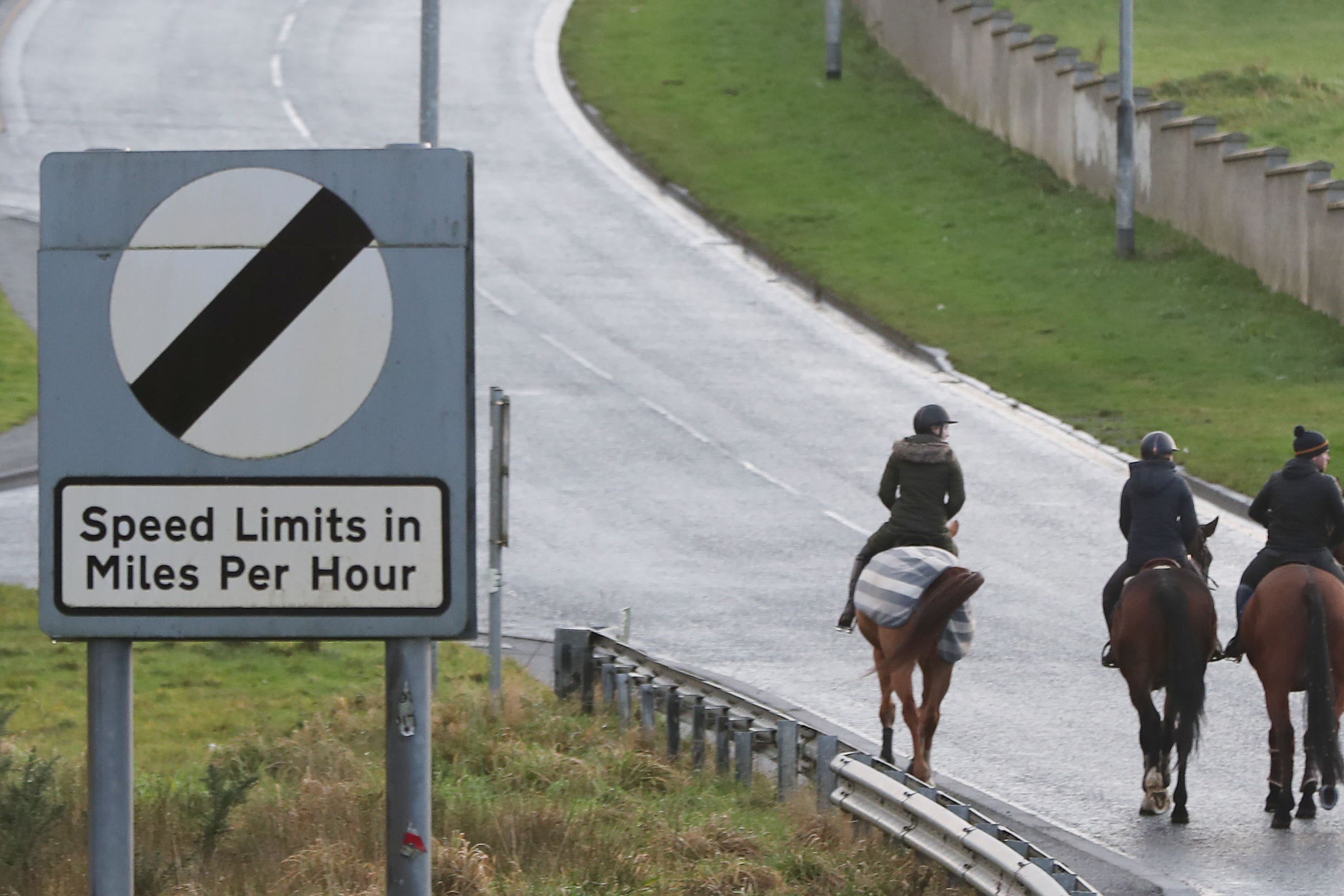 Riders cross the border from the Republic of Ireland in Northern Ireland at Carrickcarnan in Co Louth (Niall Carson/PA)